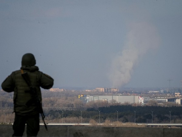 Blue and yellow flag, Russian dead attest to Ukrainian advance in south
