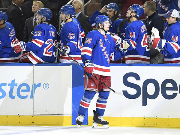 Rangers player wipes out on ice before hockey game