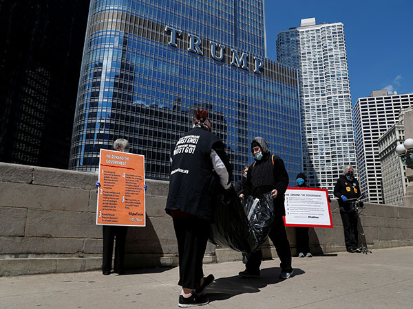 Man who hung off side of Trump Tower Chicago for 14 hours escaped from private ambulance, police say