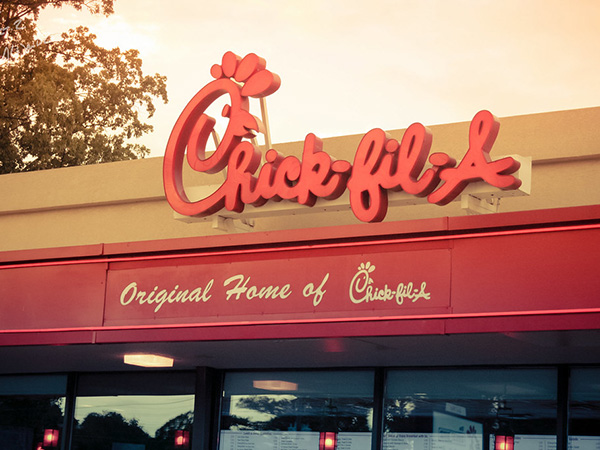 Chick-fil-A customer desperately tries to escape high chair after sitting in it on a dare