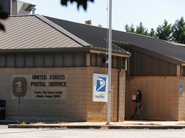 Postal Service losing billions and delivering fewer packages as it burns cash