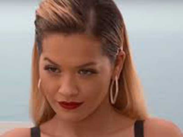 Rita Ora shares topless photos taken after she 'gets bored' sunbathing