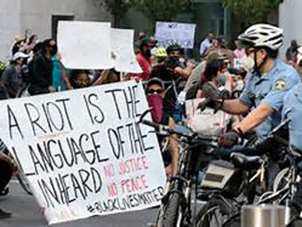 George Floyd unrest: Police out in force in major cities to tamp down on riots as curfews take effect