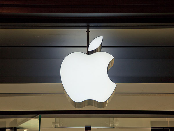 Apple shares fall despite surprise revenue gain