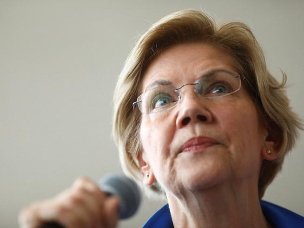 Warren, at Iowa town hall, likes 'frame' of question on 'US-supported murder