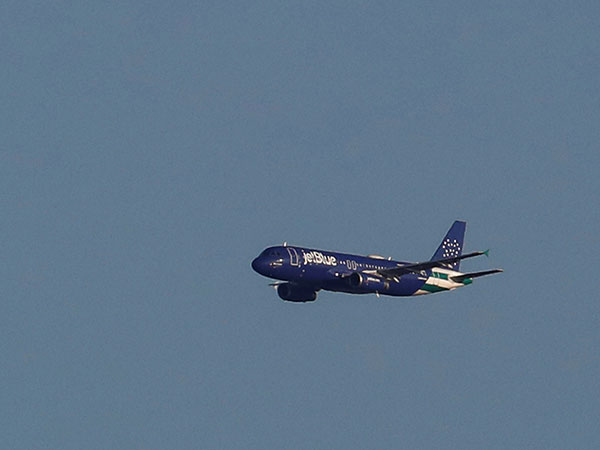 JetBlue passenger wearing Burger King crown hurls racial slurs, assaults flight attendant on plane