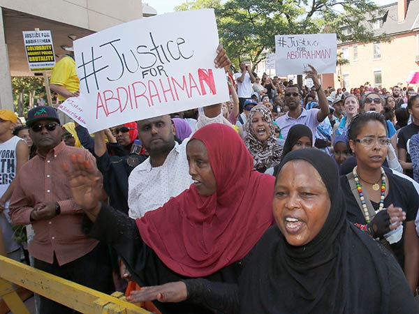 Protesters rally over not-guilty verdict in death of Abdirahman Abdi