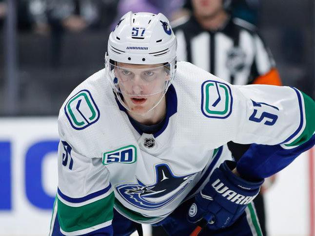 Myers scores 2 goals to spark Canucks to victory over Flames