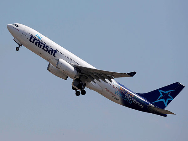 Air Transat lays off half of its remaining flight attendants, closes Vancouver base