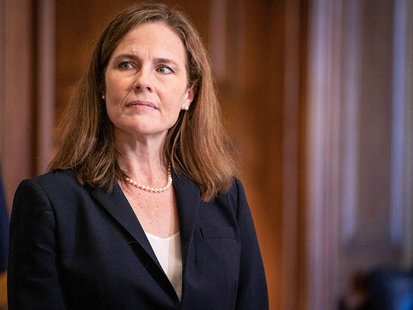 Senate leadership exchange angry jibes after the vote to advance Amy Coney Barrett
