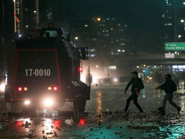 Protesters throw stones at government buildings in Colombia's capital