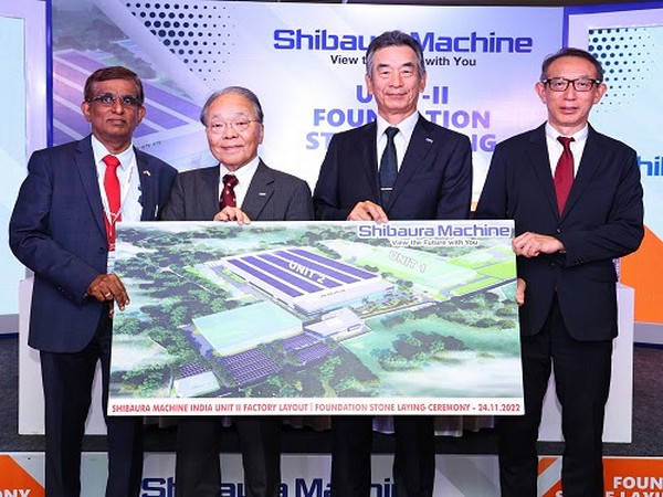 The top leadership team of Shibaura Machine Group is posing with the new factory picture at Chennai