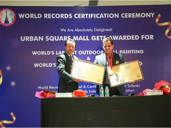Uddhav Poddar, MD, Bhumika Group receiving Certificate from Pavan Solanki, President, World Records India & Genius Foundation