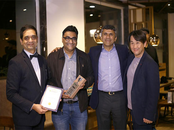 Representatives from HT Media Ltd being honored at the Enterprise AI awards by Findability Sciences