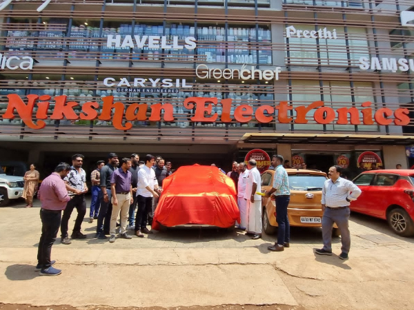 Nikshan Electronics and LG Home Appliances hand over car to lucky draw winner
