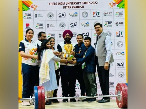 Chandigarh University Women's team while receiving the 'Weightlifting Overall Trophy' at Khelo India University Games 2023