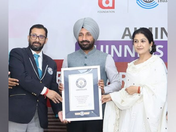 Chancellor Chandigarh University & CWT Founder Satnam Singh Sandhu receiving the record certificate from Guinness World Records officials for Largest Distribution of Sanitary Products in 24 hours