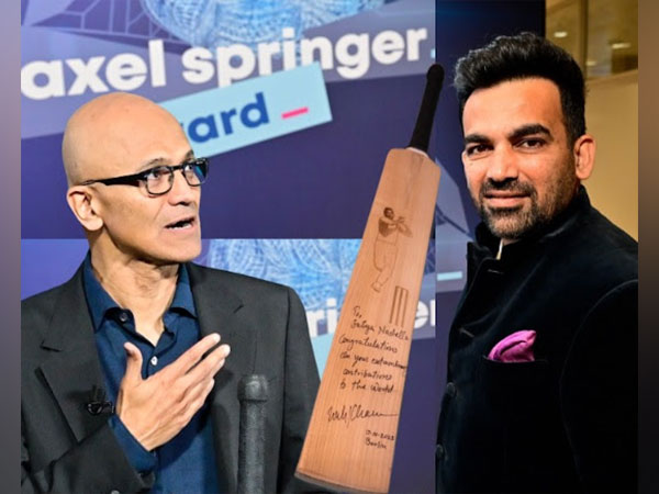 Satya Nadella receives an autographed bat from Zaheer Khan at Axel Springer Awards
