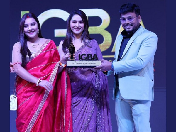 Tapas Biswas (Founder Leader Of Renatus Wellness) and Wife Angita Biswas Receive Award from Actress Madhuri Dixit at Indo Global Business Awards