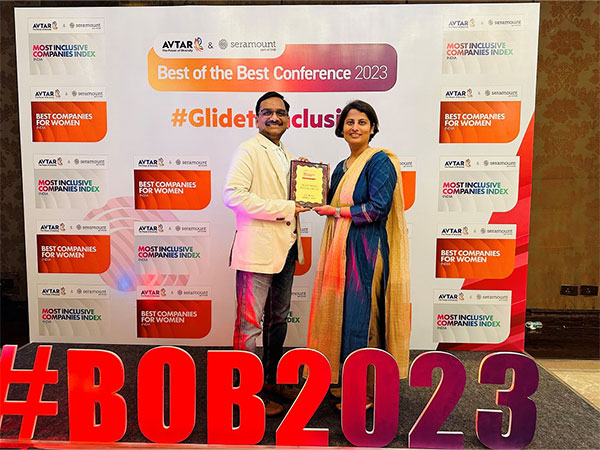 Subbu, Group CEO, and Garima Pant, Group HR Director receiving the Top 100 Companies for Women in India trophy for MullenLowe Lintas Group India