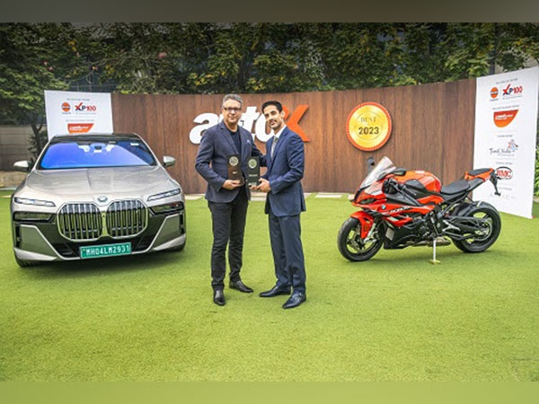 From L to R: Vikram Pawah, President & CEO, BMW Group India, receiving the 'Best of 2023' award(s) from Dhruv Behl, Founder and Editor-In-Chief, autoX
