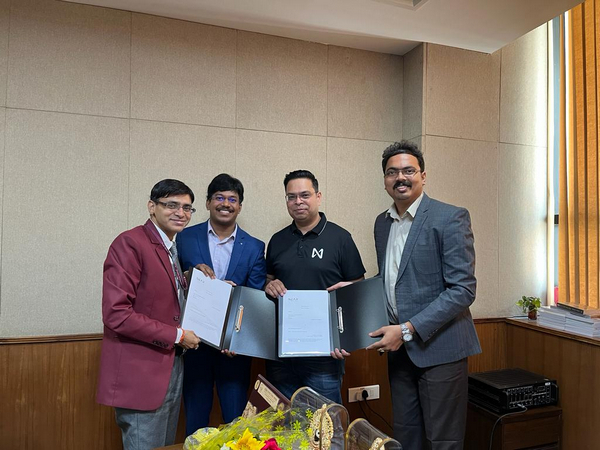Aravind Voruganti and Sunil Yadavalli from IDS exchanging MoU with Arpit Sharma, MD-NEAR in the esteemed presence of Chandrashekar Buddha, CCO AICTE