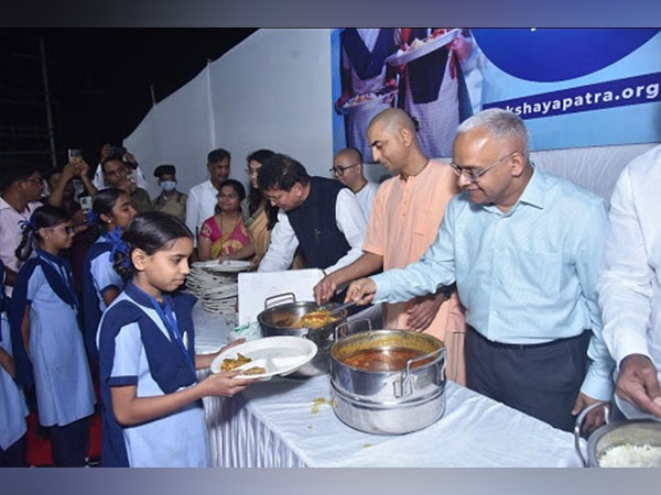 Dignitaries serving meals at the newly inaugurated kitchen in Panvel