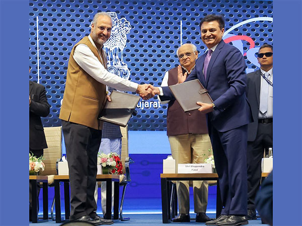 Gursharan Singh, Sr. VP of Micron exchanges the MoU with Sanjay Sharma, NAMTECH Board member, in the presence of Gujarat Chief Minister Bhupendrabhai Patel at the Vibrant Gujarat 2024 summit today