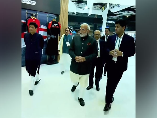 Prime Minister Narendra Modi, Piyush Goyal - Minister of Commerce, Sudarshan Venu, MD, TVS Motor Company at TVS Motor Pavilion at Bharat Mobility Global Expo