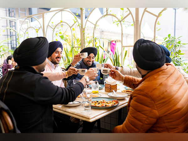 A group of friends, savouring every sip and bite, surrounded by laughter and making cherished memories at DLF Promenade