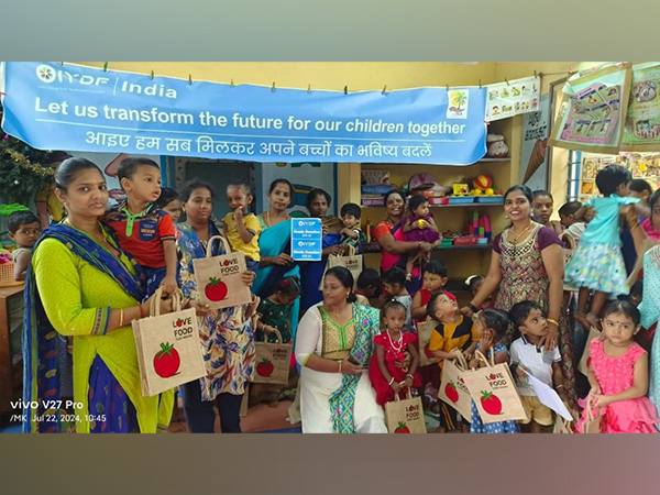 Volunteers from IYDF and Malini Kalyanam distribute supplies and bring joy to children at Balvadii ICDS.