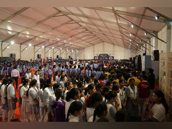 School students engaging with interactive models and exploring the journey of ISRO at the exhibition, gaining insights through various learning modules