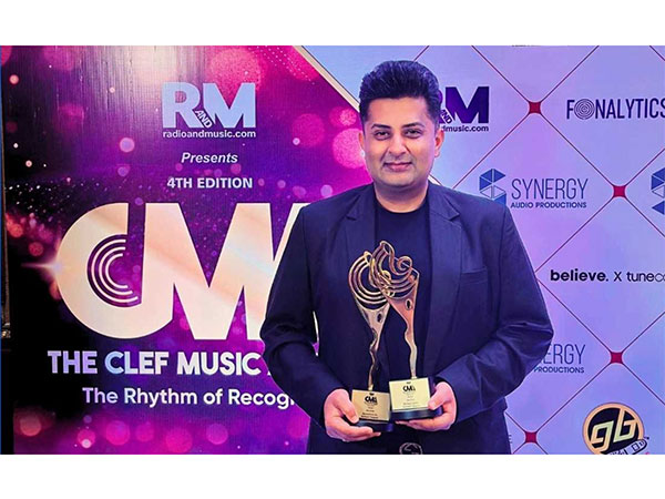 Sumeet Tappoo proudly hold his CLEF Awards trophies