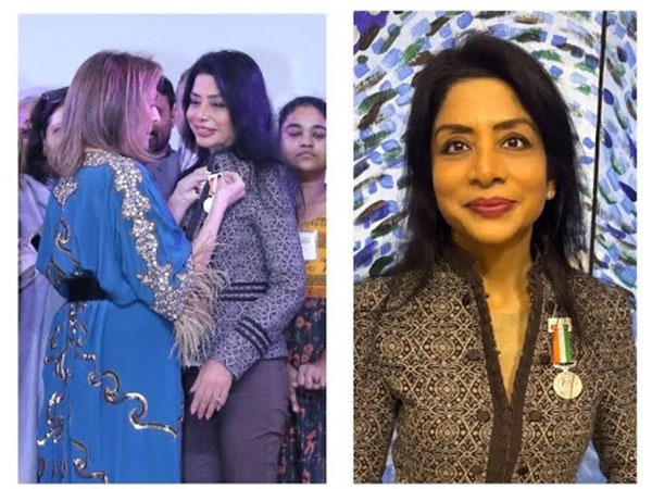 Princess Francoise Sturdza pinning the medal on Indrani Mukerjea