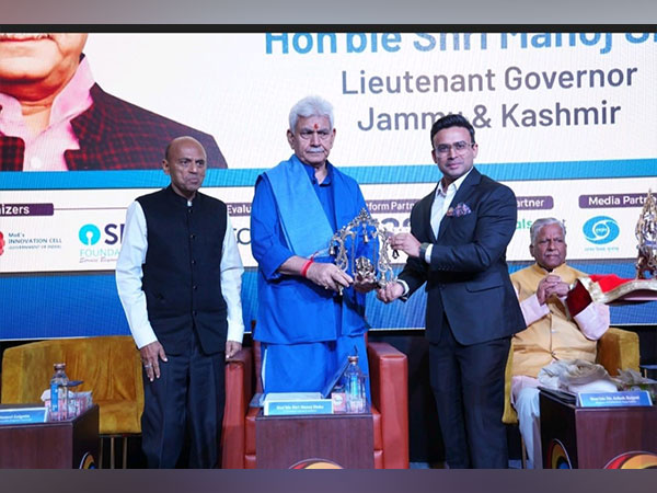 Chancellor Suneel Galgotia and Dr. Dhruv Galgotia present a memento to Manoj Sinha, LG J&K.