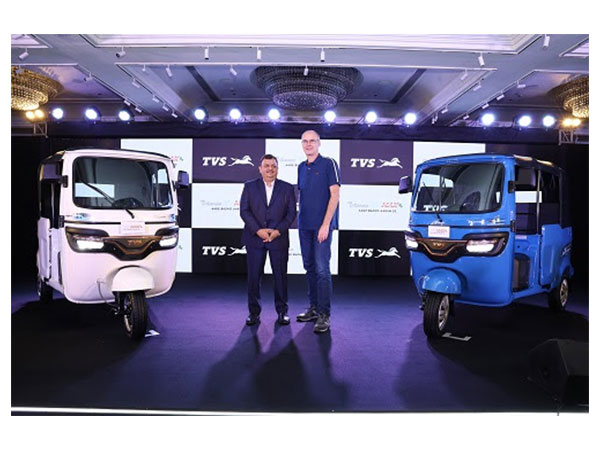 Rajat Gupta - Business Head, Commercial Mobility and Bernhard Heiming - CTO, TVS Motor Company, with the newly launched TVS King EV MAX