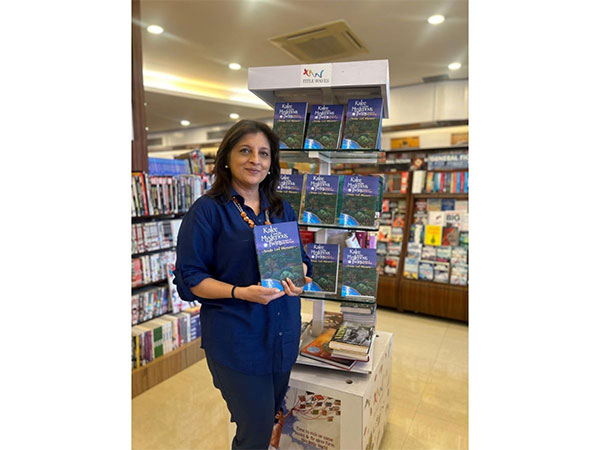 Sunita Lad Bhamray with her book