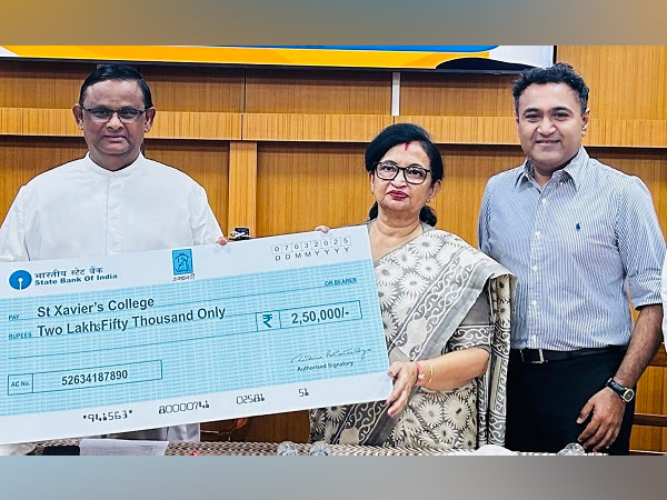 Minister Chandrima Bhattacharya handing over the cheque to Rev. Fr. Dominic Savio & Debaditya Chaudhury