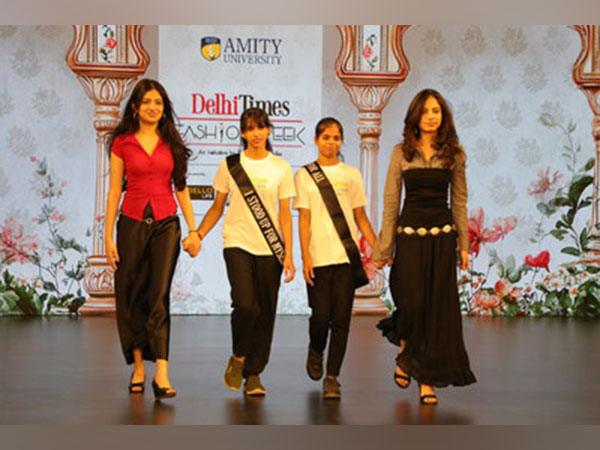 Samaya (extreme left) and Samara (extreme right) walk with children from NGO Pravan, in support of mental health awareness & educational equality.
