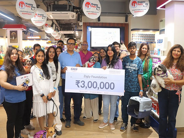 Cheque for the proceeds from ticket sales being handed over to Zigly Foundation