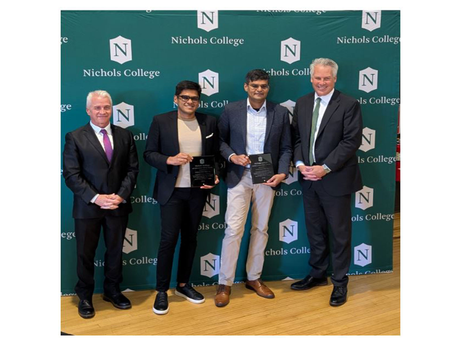 From left to right - Provost Daniel Borgia, Nishant Rathi, Nikhil Rathi, President Bill Pieczynski