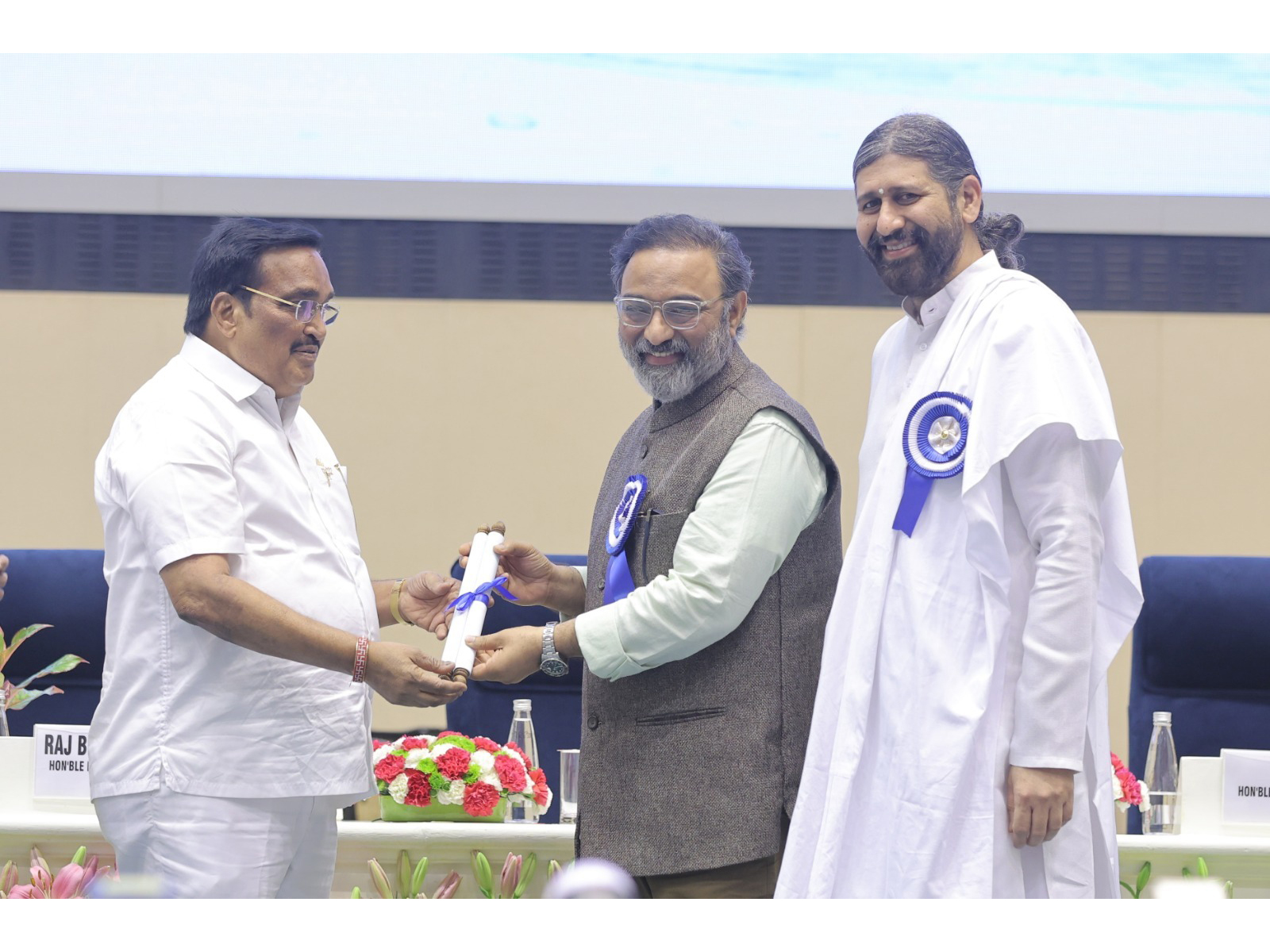 Shri Prasana Prabhu and Shri Br. Pragyachaitanya receiving the Best Civil Society Award from Union Jal Shakti Minister Shri C.R. Patil