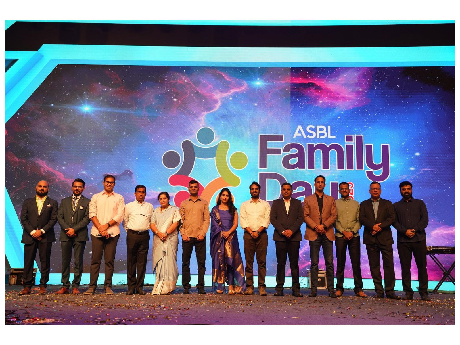 ASBL Founder and CEO Ajitesh Korupolu with key members of the ASBL journey on stage at ASBL Family Day