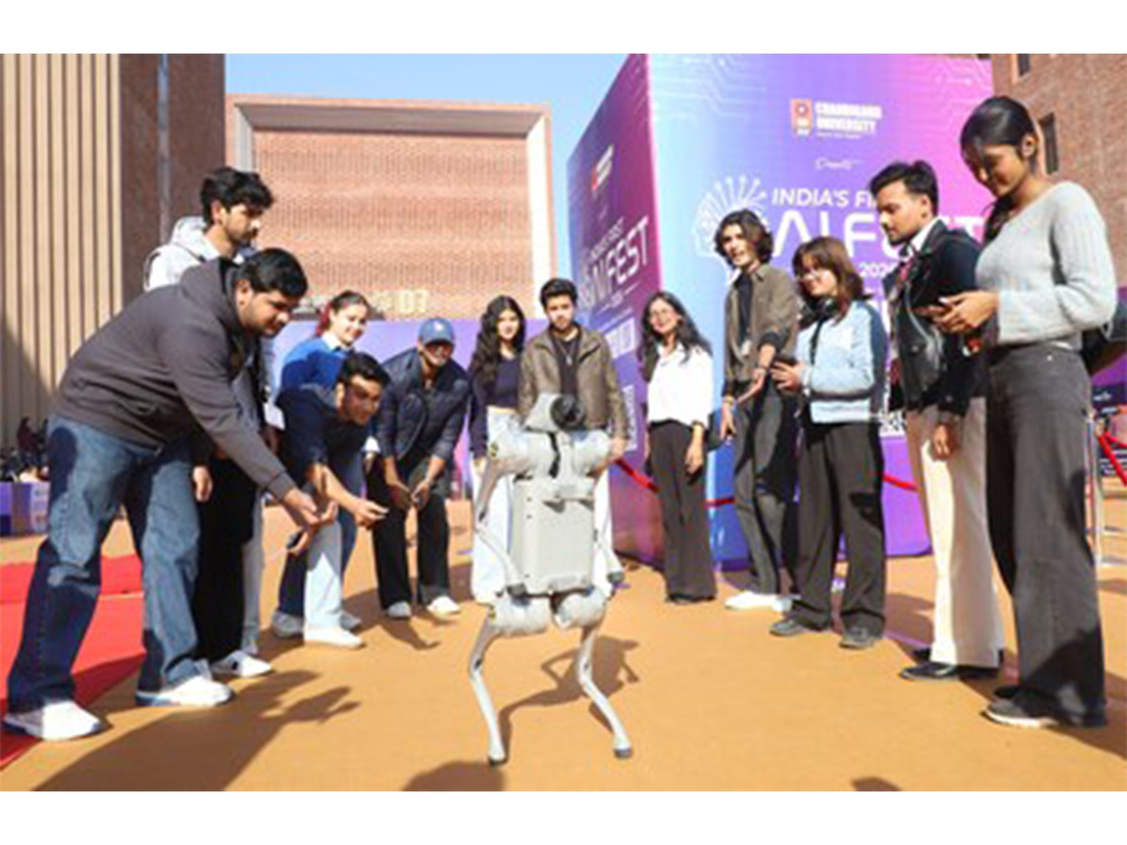 Chandigarh University Students Playing with the robot during the launch of India's first AI Fest 2026 at Gharuan campus