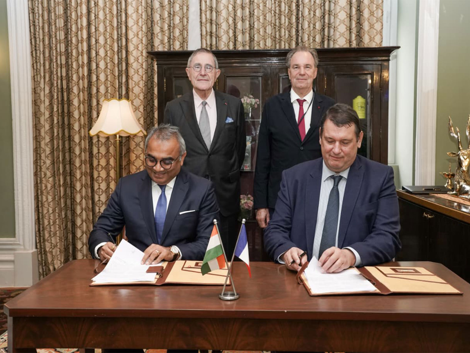 Ashwani Gupta, Whole-time Director and CEO, APSEZ, Herve Martel, CEO, Marseille Fos. ; Standing: Gerard Mestrallet, Special Envoy, French President for IMEC. Renaud Muselier, President of South Region  (Photo- Adani Group)