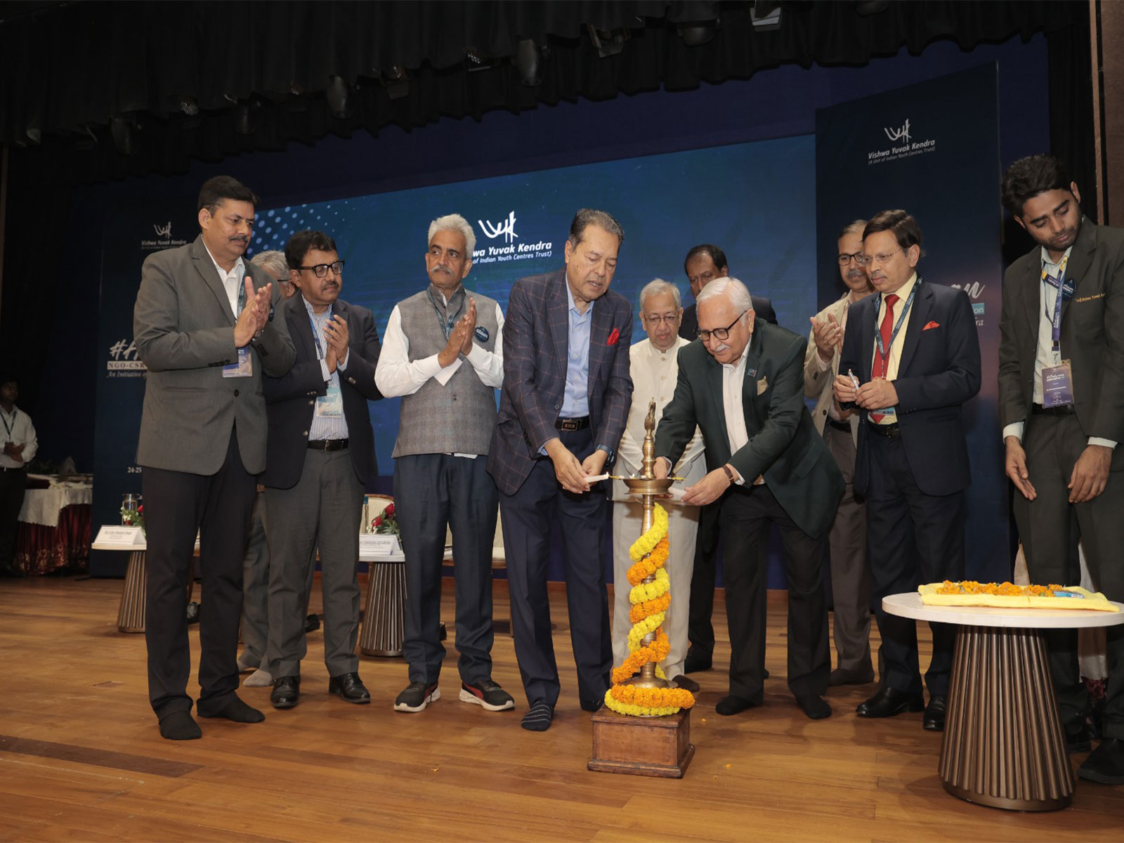 Inaugural lamp lighting at Vishwa Yuvak Kendra's Aahvaan 2026, symbolising shared commitment to collaboration, impact, and inclusive development