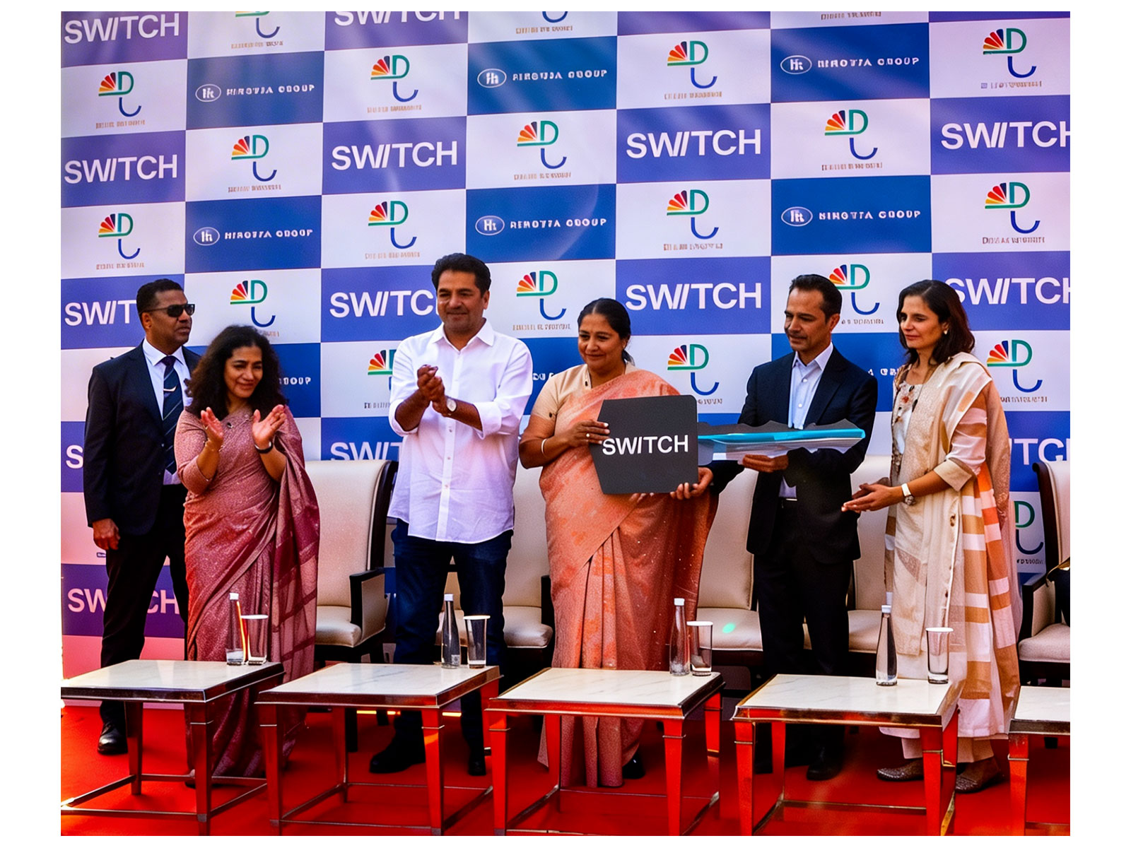 Delhi CM Rekha Gupta ( Center ), Tourism minister Kapil Mishra (Left) Mr Dheeraj Hinduja Chairman of Ashok Leyland (Right) in the presence of his wife Shalini Hinduja (Extreme Right)