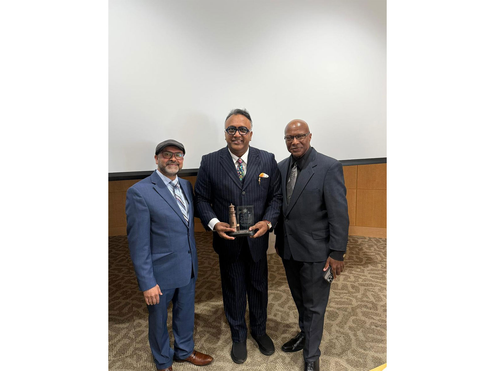 Professor Dr. Uttam Gowli, President & Dr. Keith Wright, Vice President, Star Scholars Network presenting the Lighthouse Leadership Award to Professor Dr. C. Raj Kumar 