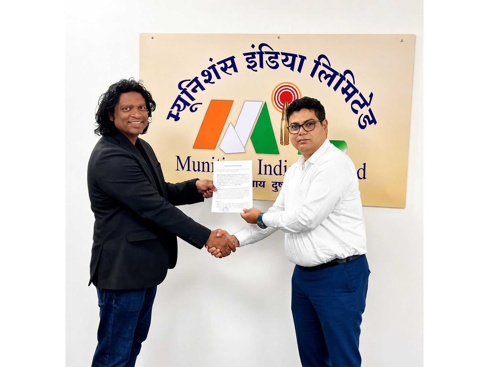 Lt Cdr John Livingstone (Retd), Founder & CEO of Johnnette Technologies, exchanging the signed MoU with Mr. Kumar Vaibhav Gour, I.O.F.S., Executive Director, Munitions India Limited.