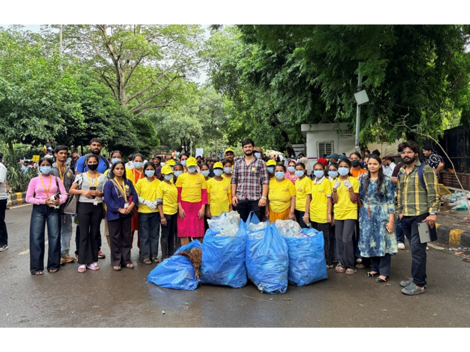 Maid In India Leads Cleanliness Drive at Delhi Protest Site. Yellow T-Shirts, Blue Bags, One Mission.